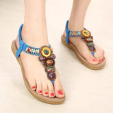 Sandalen mit flachem Absatz und Knöchelriemen